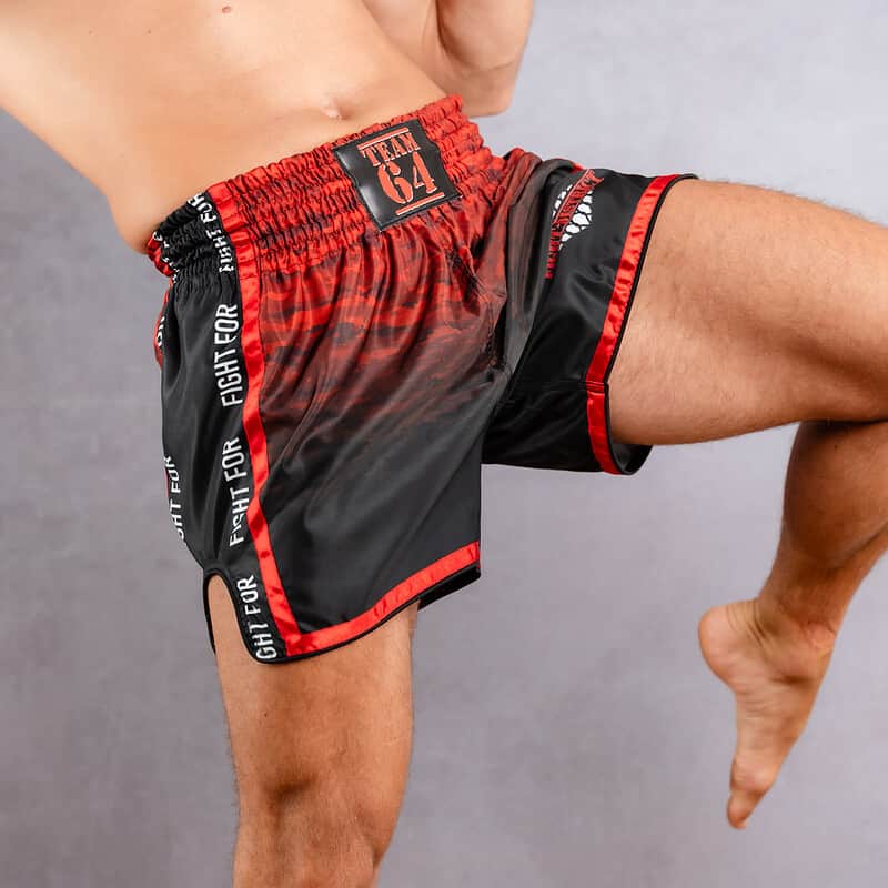 front boxing fight district shorts worn by a kicking man