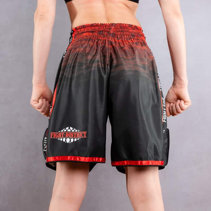 muay thai fight district back shorts worn by a woman
